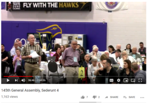 Who is that guy speaking to assembly?