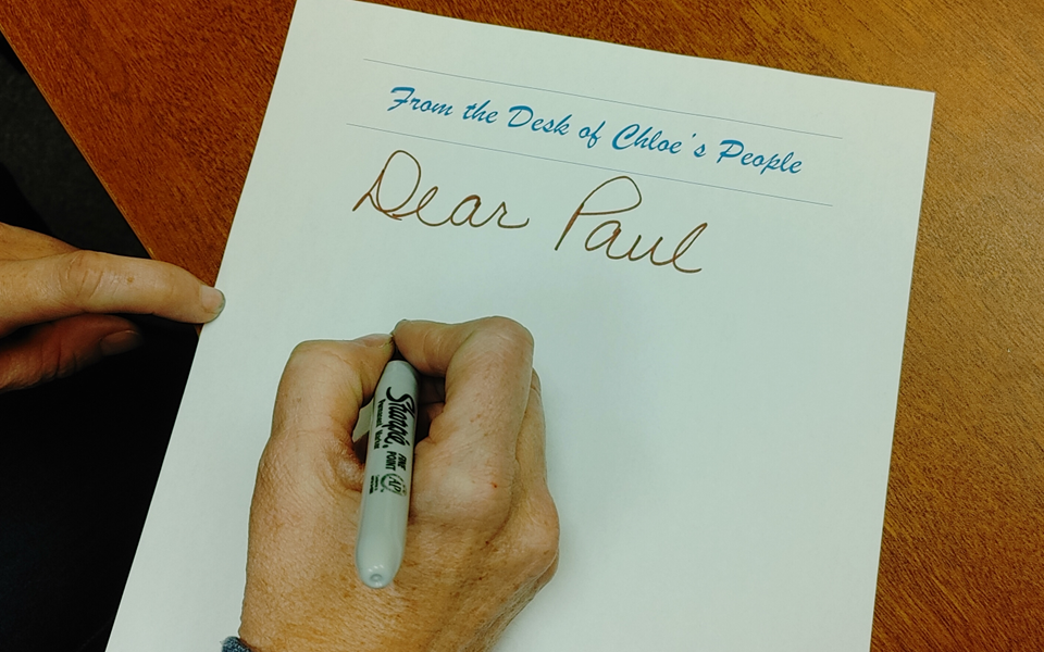 Someone writing a letter that starts, "Dear Paul..."